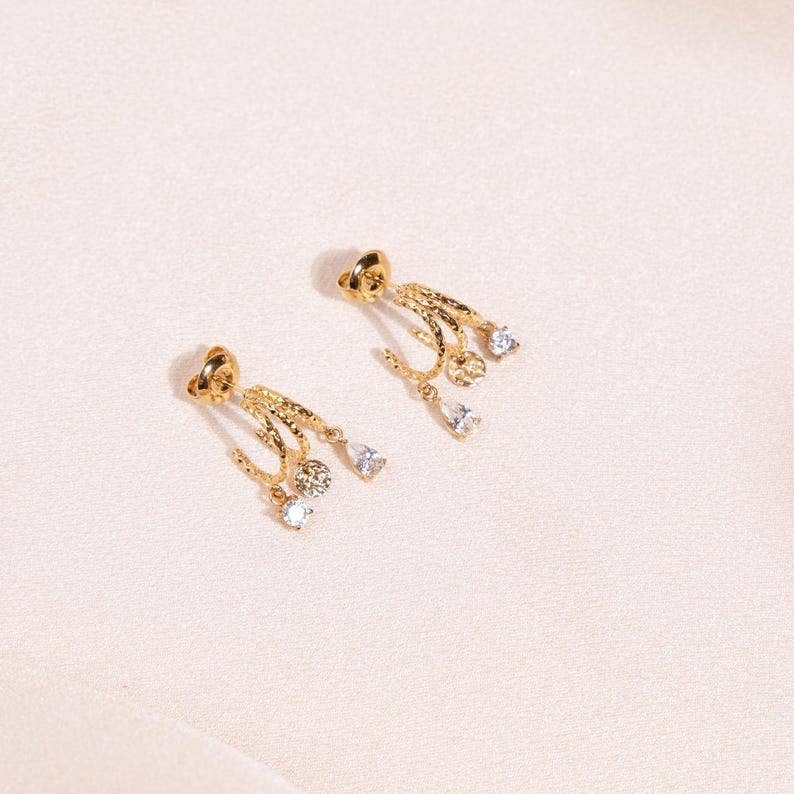 Boucles d'oreilles acier inoxydable trois anneaux ornée de zirconium