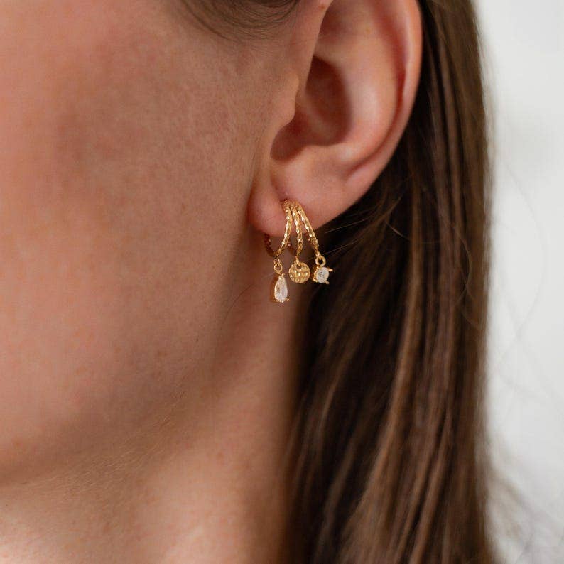 Boucles d'oreilles acier inoxydable trois anneaux ornée de zirconium
