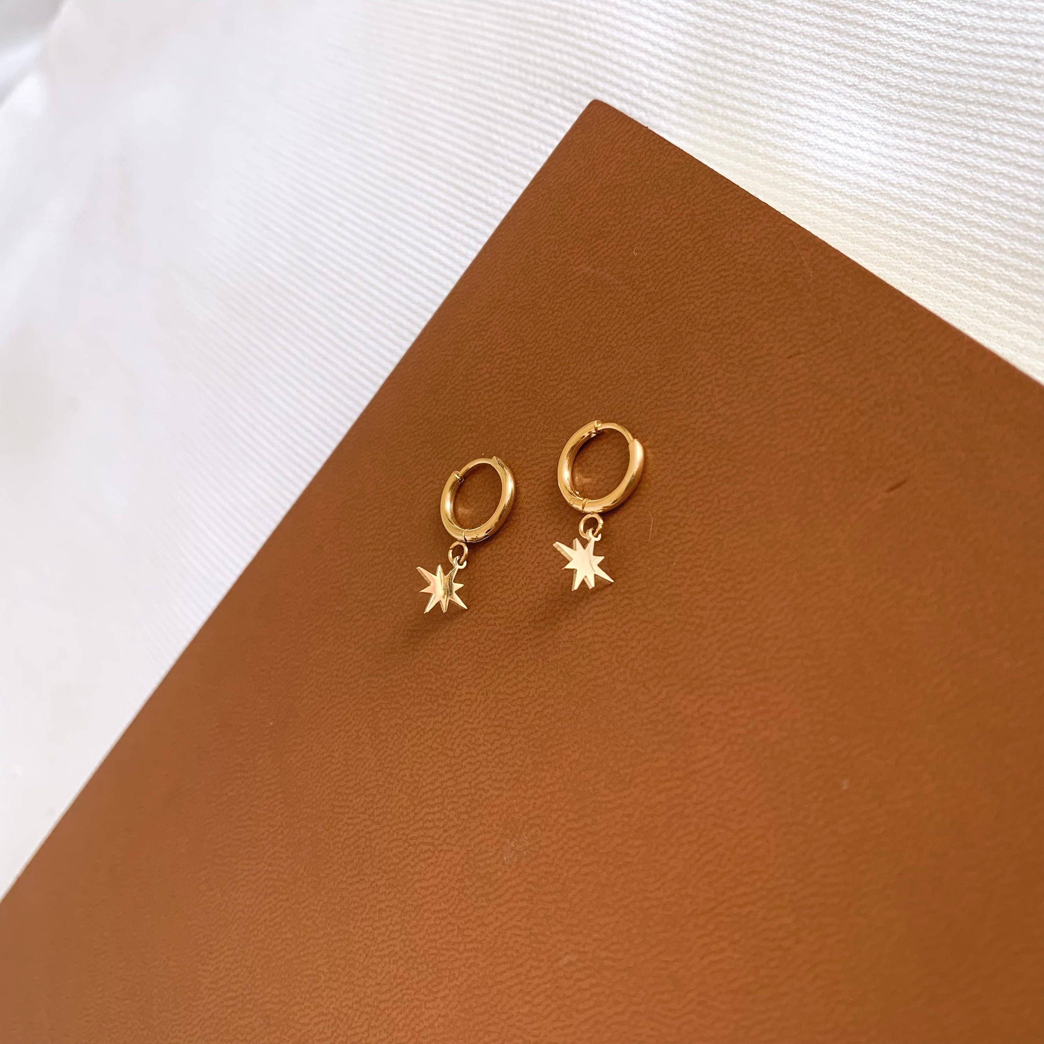 Petites créoles acier inoxydable pendentif étoile